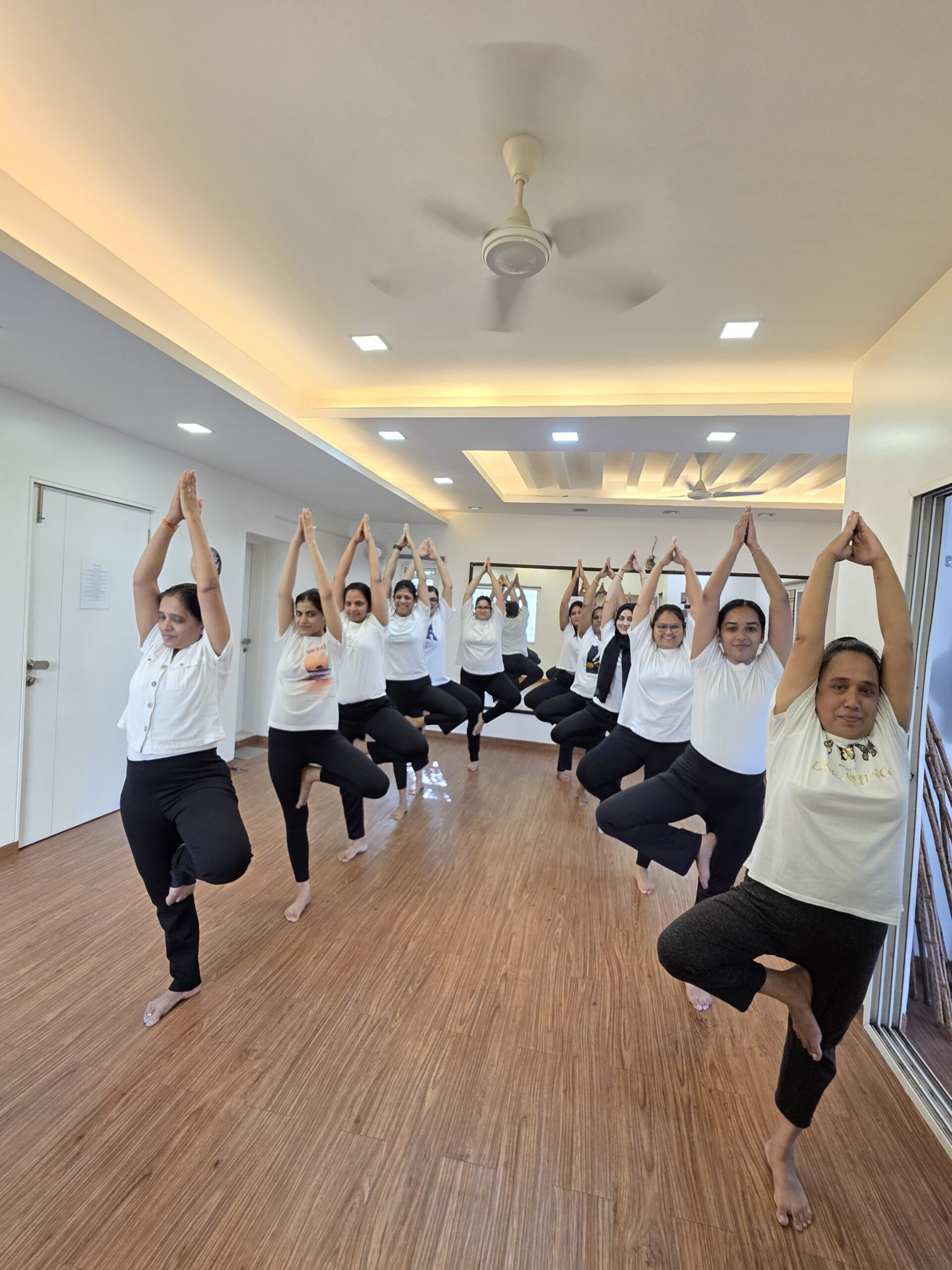 Soulz Fitness students performing Vrikshasana Tree Pose together on International Yoga Day 2026